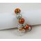 Silverarmband med orangefärgade pärlor och rosett