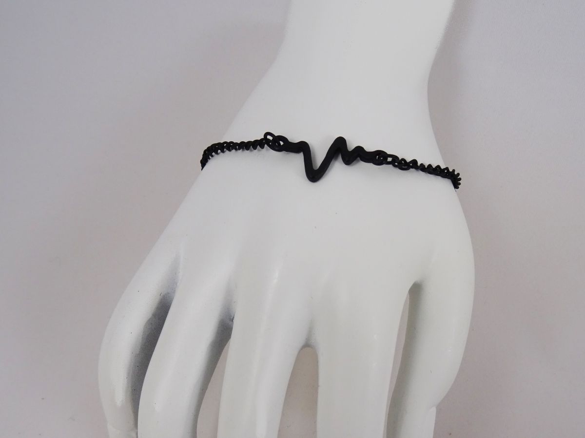 Tunn svart armband design Waves