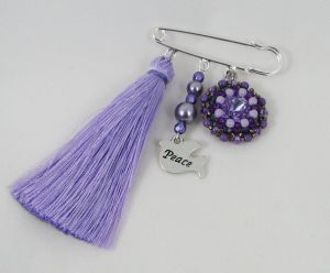Lila vänskapsbrosch med Pompon 