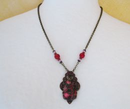 Fuchsia Jasper hängande på patina tryck